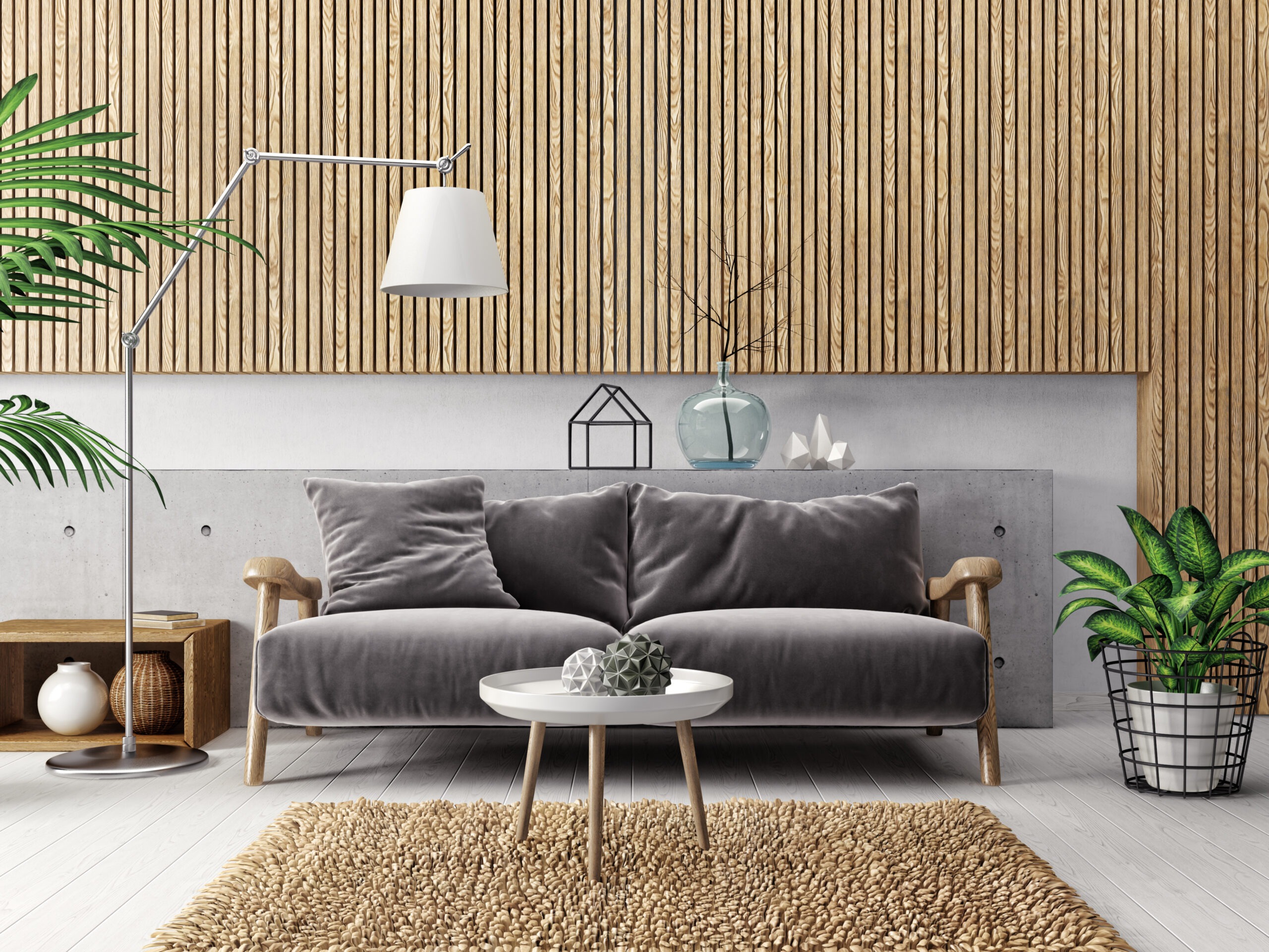Modern living room featuring a gray sofa, stylish floor lamp, decorative plants, and a textured rug against a wood-paneled wall, creating a serene atmosphere.